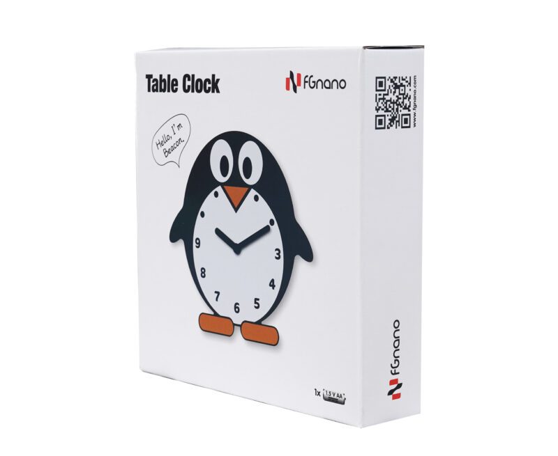 A box with a penguin clock sitting on top of it.