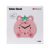 A pink table clock with the words " i 'm back " on it.